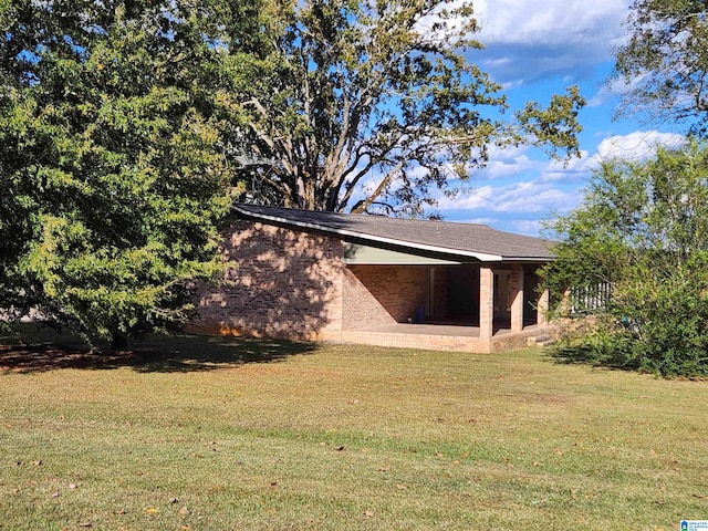 rear view of property featuring a yard