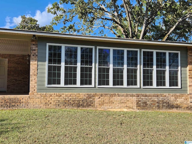 view of property exterior with a yard