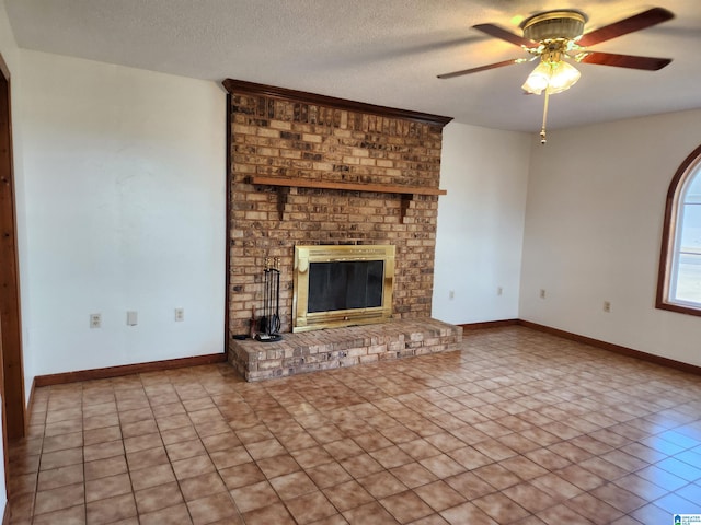 unfurnished living room featuring tile flooring, brick wall, a fireplace, a textured ceiling, and ceiling fan