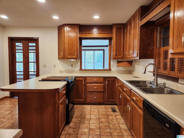 kitchen featuring black appliances, sink, kitchen peninsula, and light tile floors