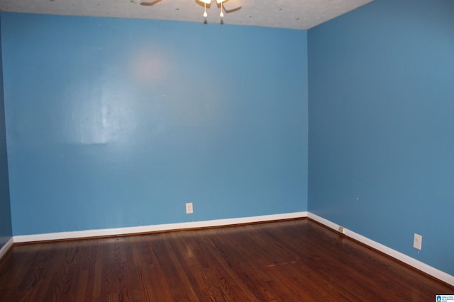 unfurnished room with ceiling fan, a textured ceiling, and wood-type flooring