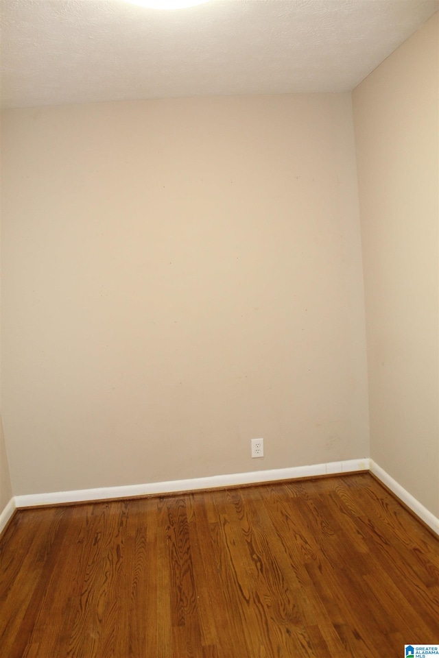 spare room featuring hardwood / wood-style flooring