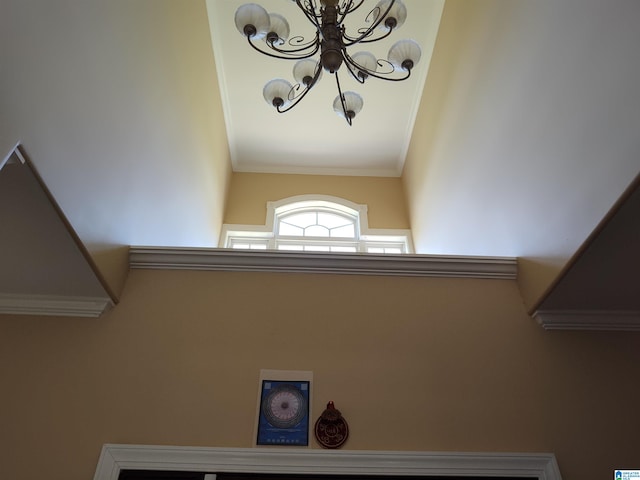 room details featuring an inviting chandelier and ornamental molding