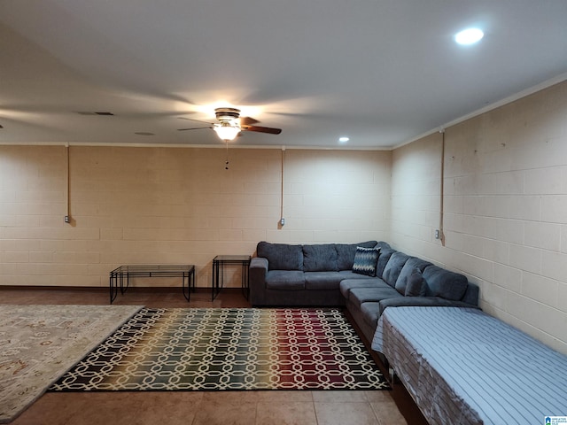 living room featuring crown molding and ceiling fan