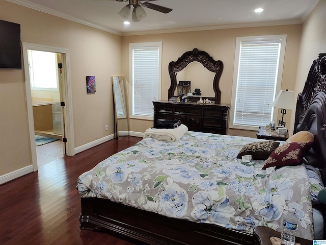 bedroom with ornamental molding, connected bathroom, ceiling fan, and dark wood-type flooring