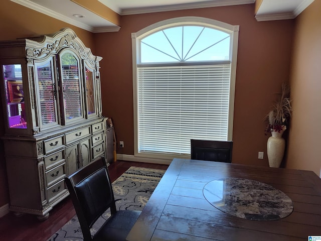 dining space with crown molding and dark wood-type flooring