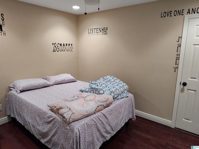 bedroom featuring dark hardwood / wood-style flooring