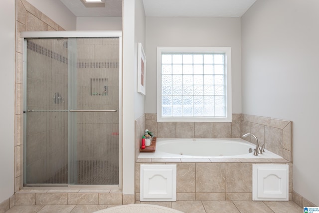 bathroom with tile patterned floors and plus walk in shower