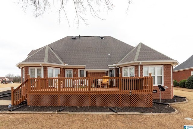 back of property featuring a deck