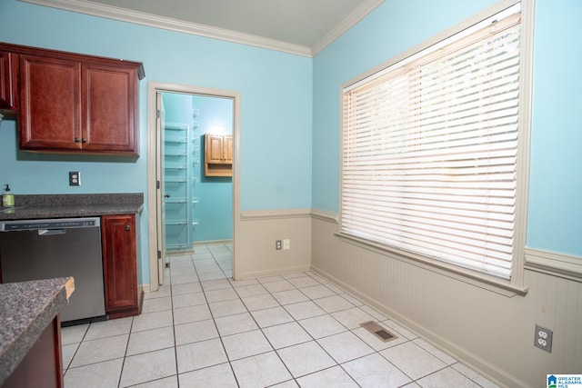 kitchen with ornamental molding, light tile flooring, and stainless steel dishwasher