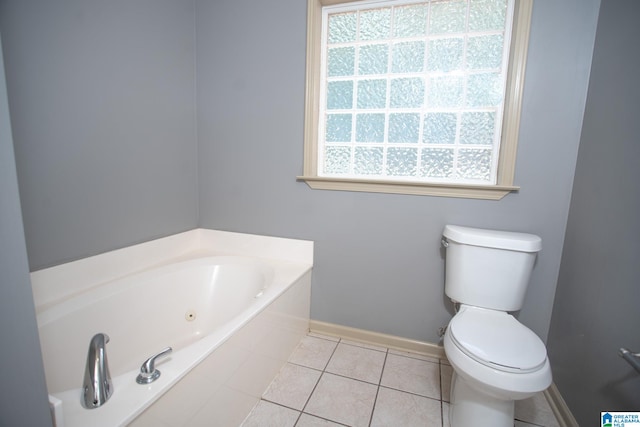 bathroom featuring tile flooring, toilet, and a washtub