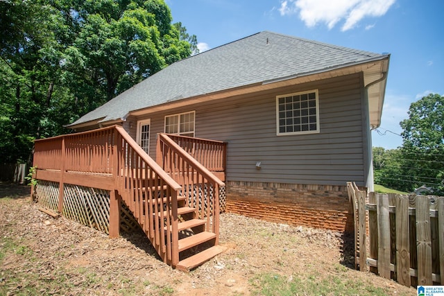 back of property with a deck