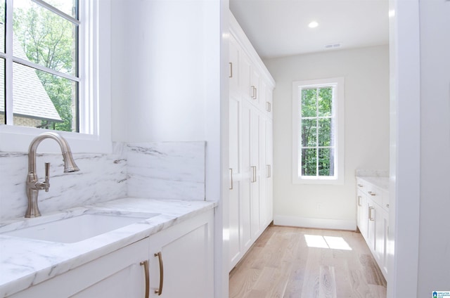 bathroom featuring vanity and wood-type flooring