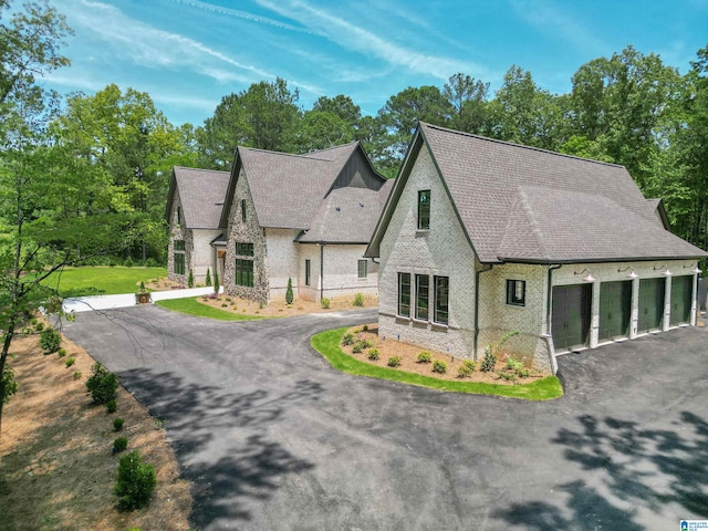 view of front of property featuring a garage and a front yard