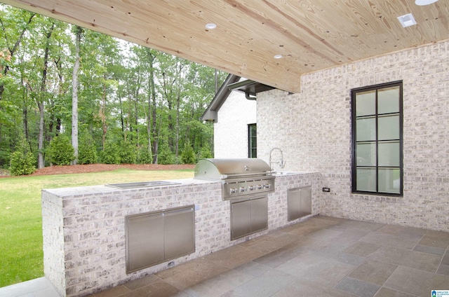 view of patio / terrace featuring an outdoor kitchen and grilling area