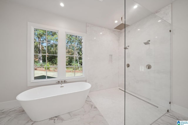 bathroom featuring separate shower and tub