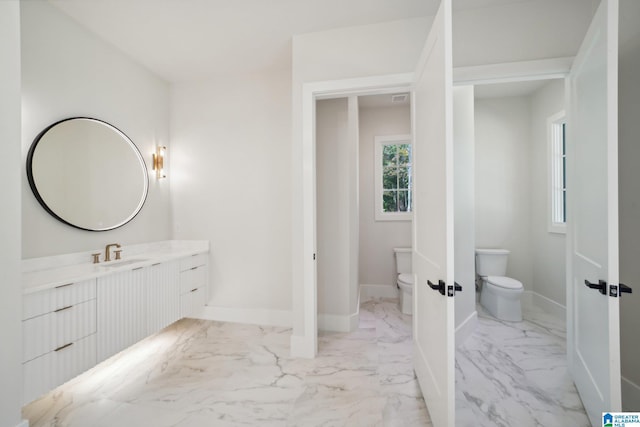 bathroom with vanity and toilet