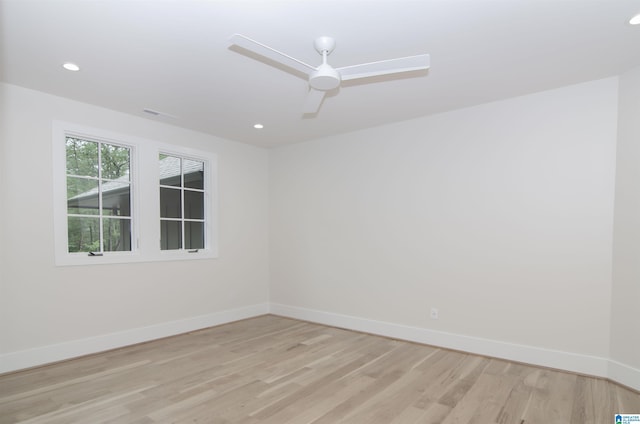 unfurnished room featuring ceiling fan and light wood-type flooring