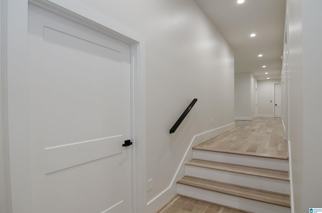 staircase featuring hardwood / wood-style floors