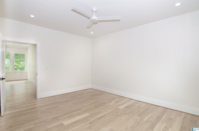 empty room featuring ceiling fan and light wood-type flooring