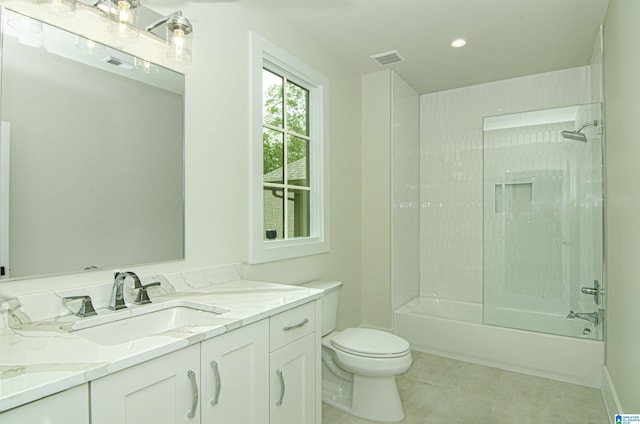 full bathroom with bathing tub / shower combination, tile patterned floors, vanity, and toilet