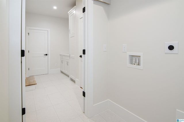 laundry area featuring washer hookup, light tile patterned floors, and electric dryer hookup