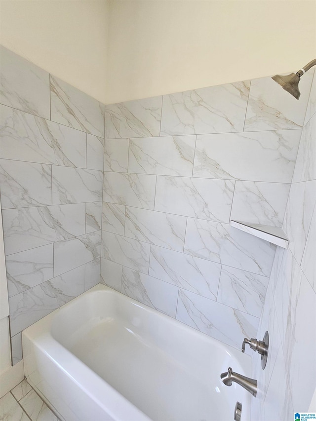 bathroom with tile floors and tiled shower / bath