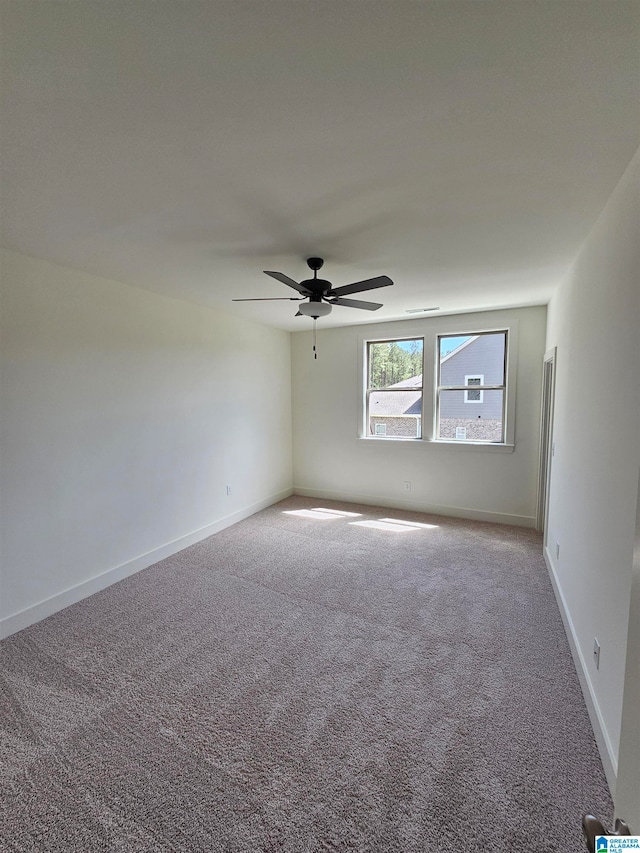 empty room with carpet and ceiling fan