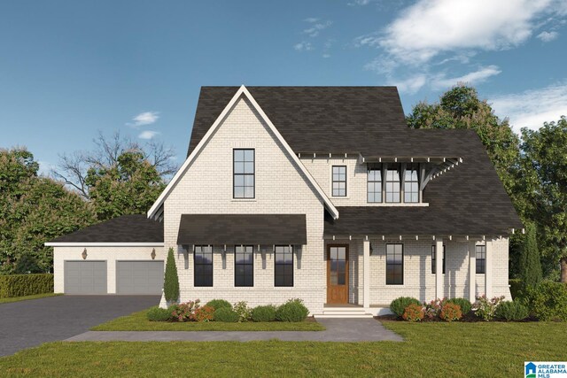 modern inspired farmhouse with a front lawn and a garage