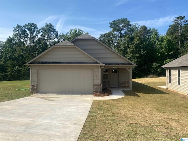 view of front of property with a garage and a front lawn