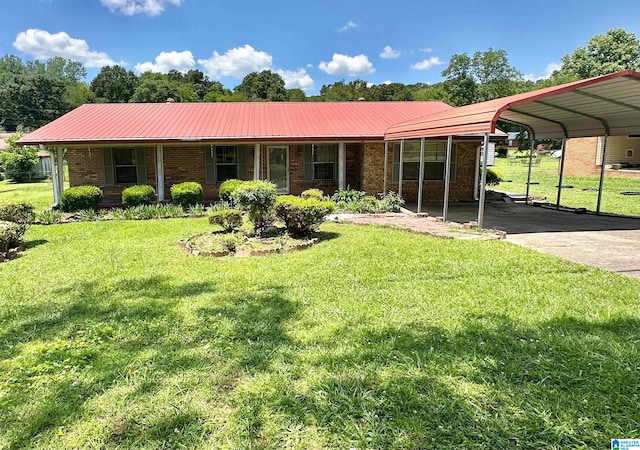 ranch-style house featuring a front yard and a carport