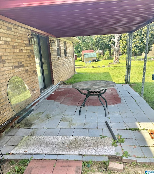 view of terrace featuring a storage unit