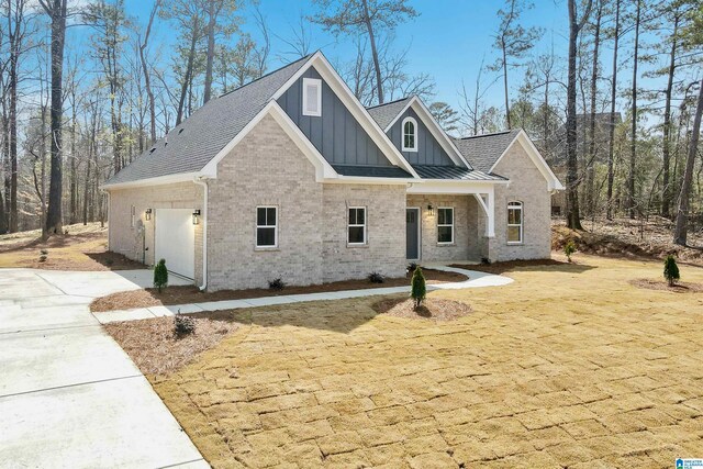 8611 Shady Trl, Helena, AL 35022 - craftsman-style house with board and batten siding, brick siding, an attached garage, and driveway