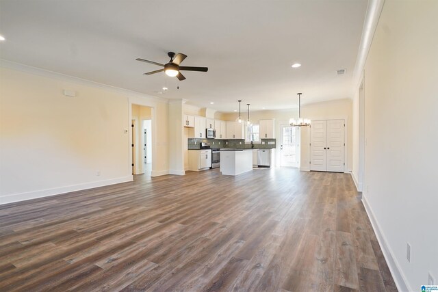 8611 Shady Trl, Helena, AL 35022 - unfurnished living room with ceiling fan, a chandelier, crown molding, baseboards, and recessed lighting