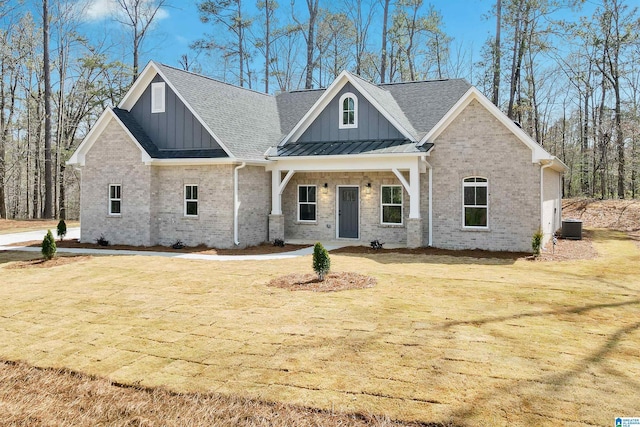 8611 Shady Trl, Helena, AL 35022 - craftsman inspired home with board and batten siding, brick siding, central air condition unit, a shingled roof, and a standing seam roof