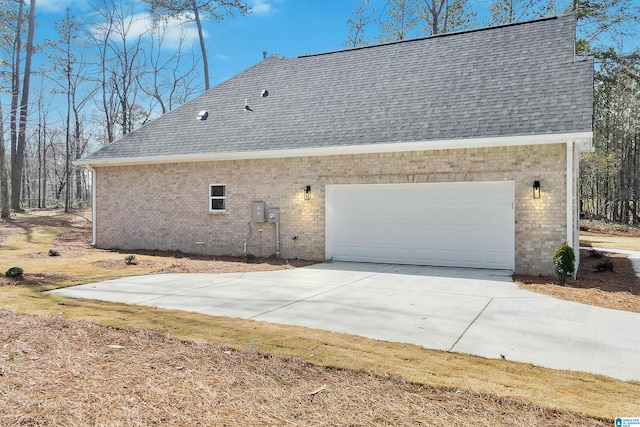 8611 Shady Trl, Helena, AL 35022 - view of property exterior with brick siding, a shingled roof, an attached garage, and concrete driveway