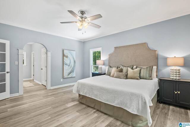 bedroom featuring crown molding, ceiling fan, and light hardwood / wood-style floors