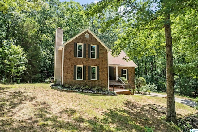 view of front facade with covered porch and a front yard