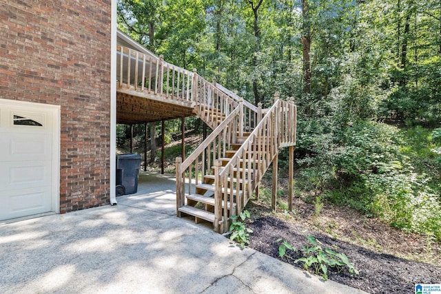 view of patio featuring a garage and a deck