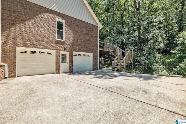 view of side of property featuring a garage