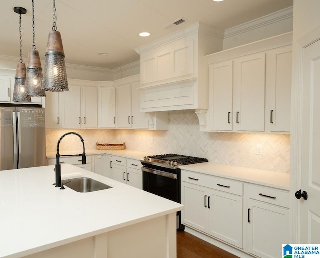 kitchen with white cabinetry, pendant lighting, stainless steel appliances, ornamental molding, and sink