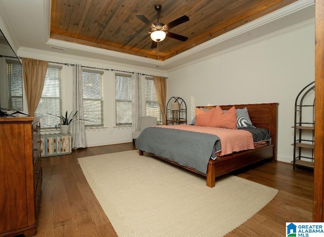 bedroom with ceiling fan, dark hardwood / wood-style floors, and multiple windows