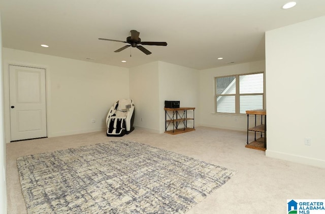 miscellaneous room featuring ceiling fan and light carpet