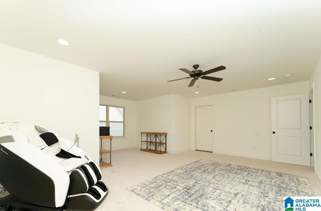 sitting room with light carpet and ceiling fan