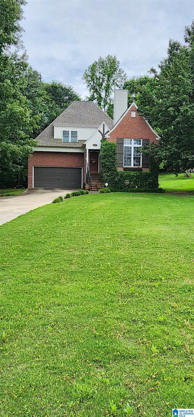 view of front facade with a garage and a front yard