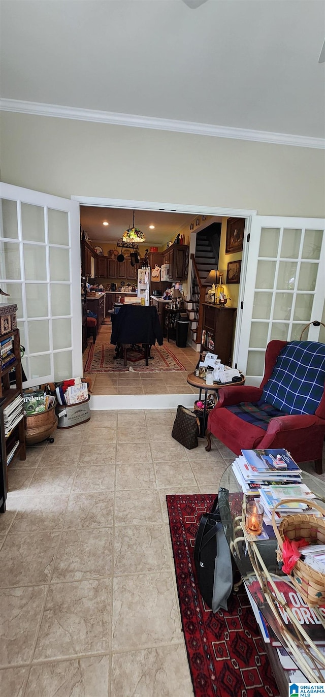 living room featuring tile flooring and ornamental molding