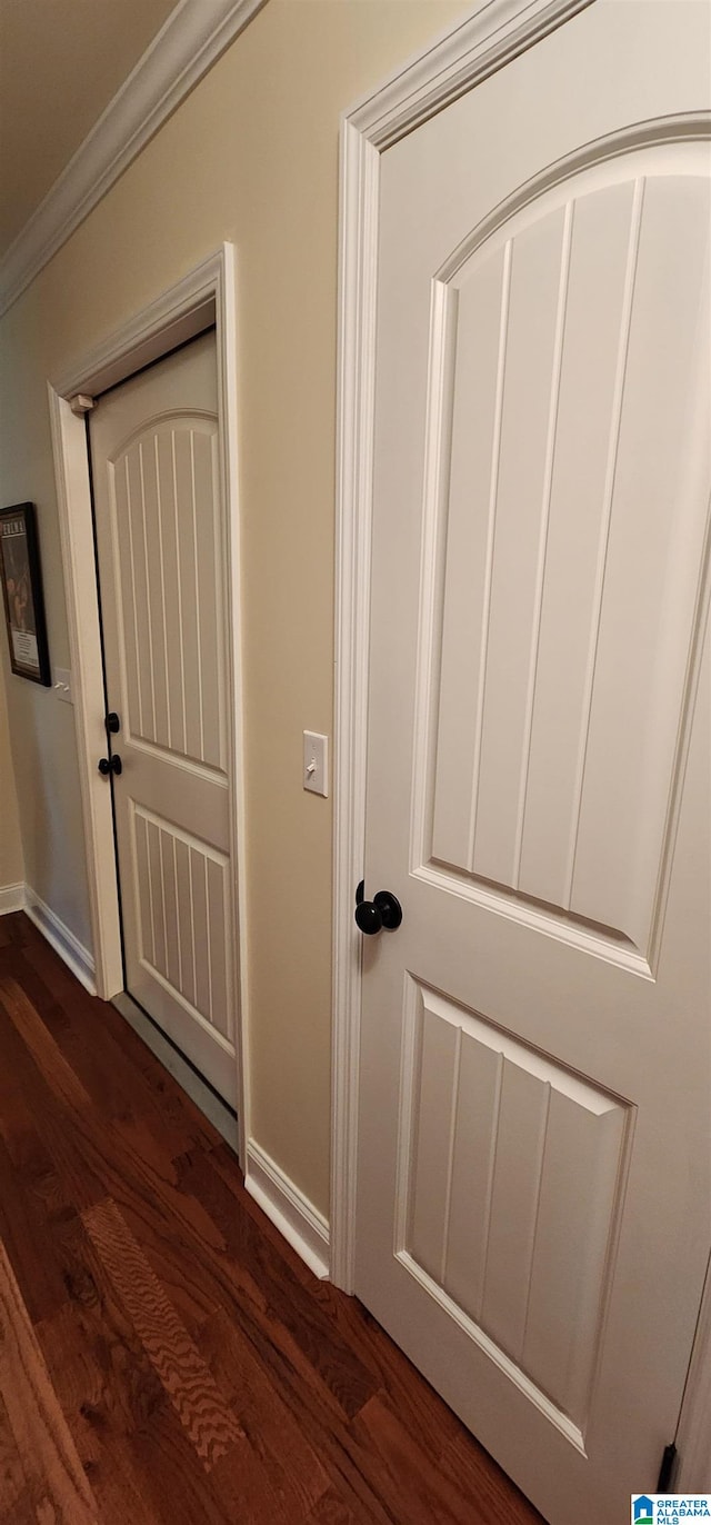 details with hardwood / wood-style flooring and crown molding