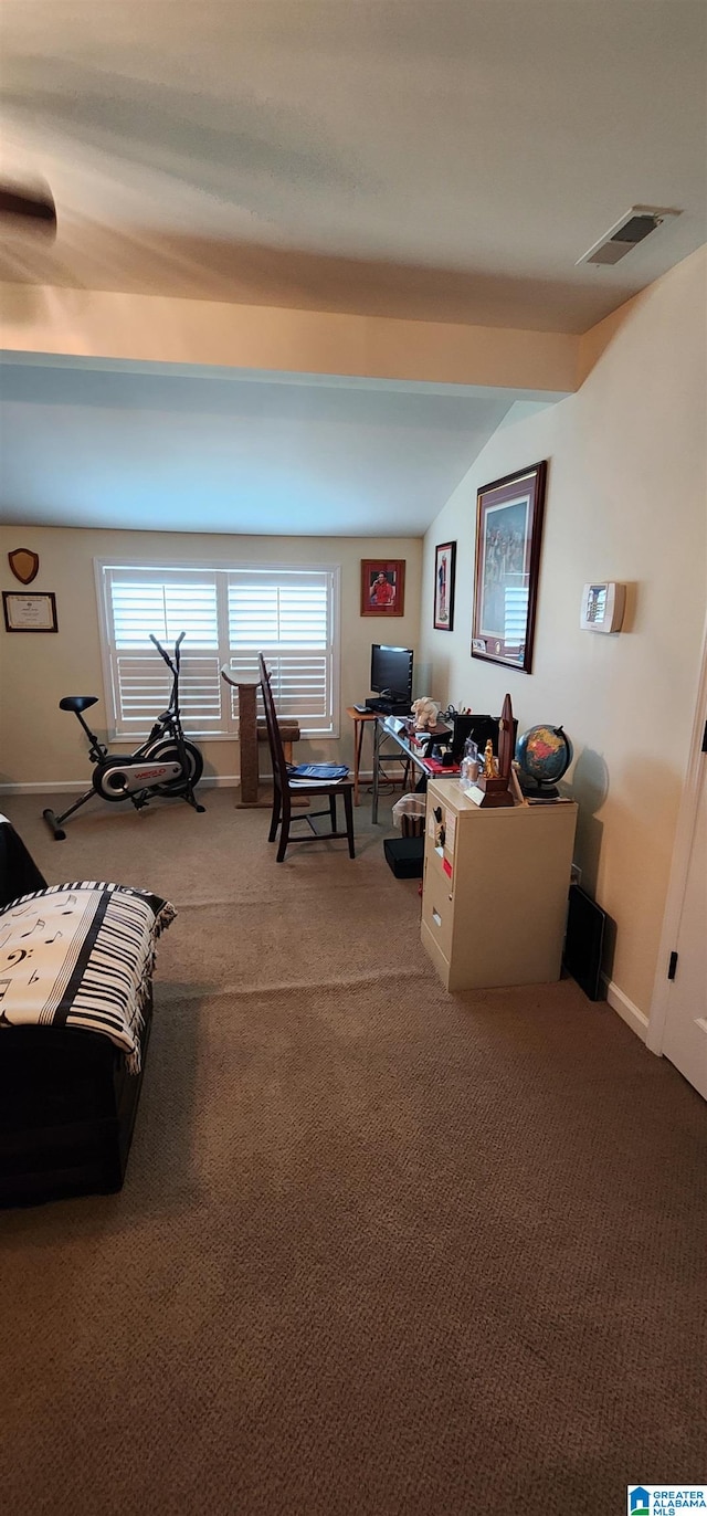 carpeted living room with lofted ceiling