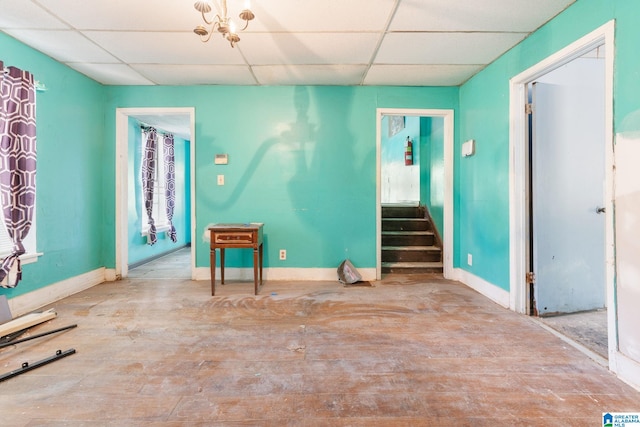 unfurnished room featuring a paneled ceiling