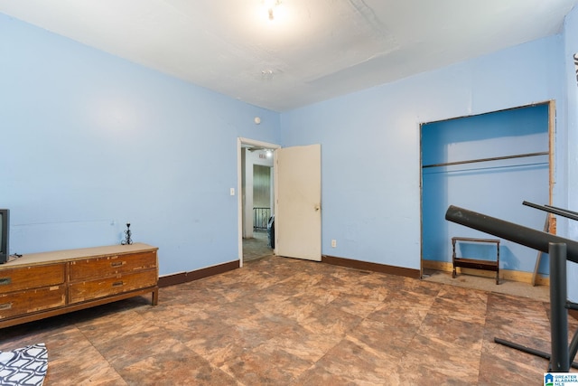 bedroom with a closet and tile floors